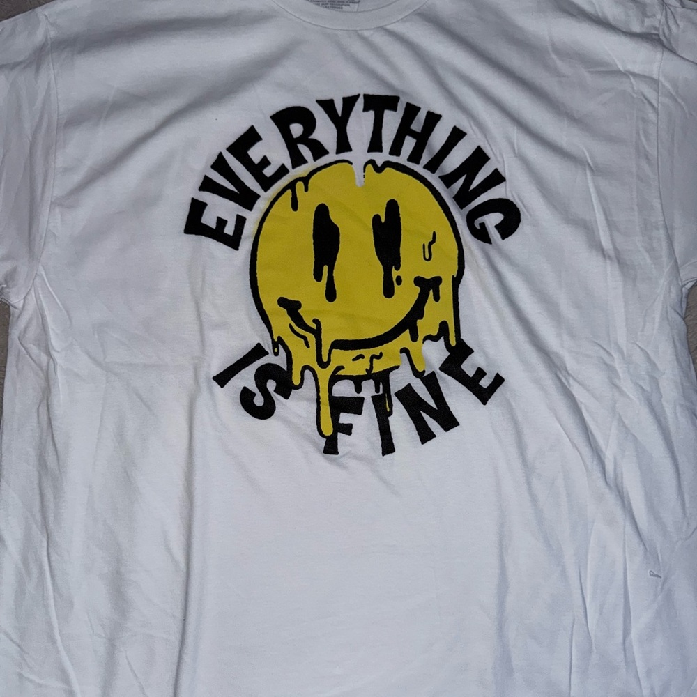 White T-Shirt with Yellow Smiley Face Graphic
